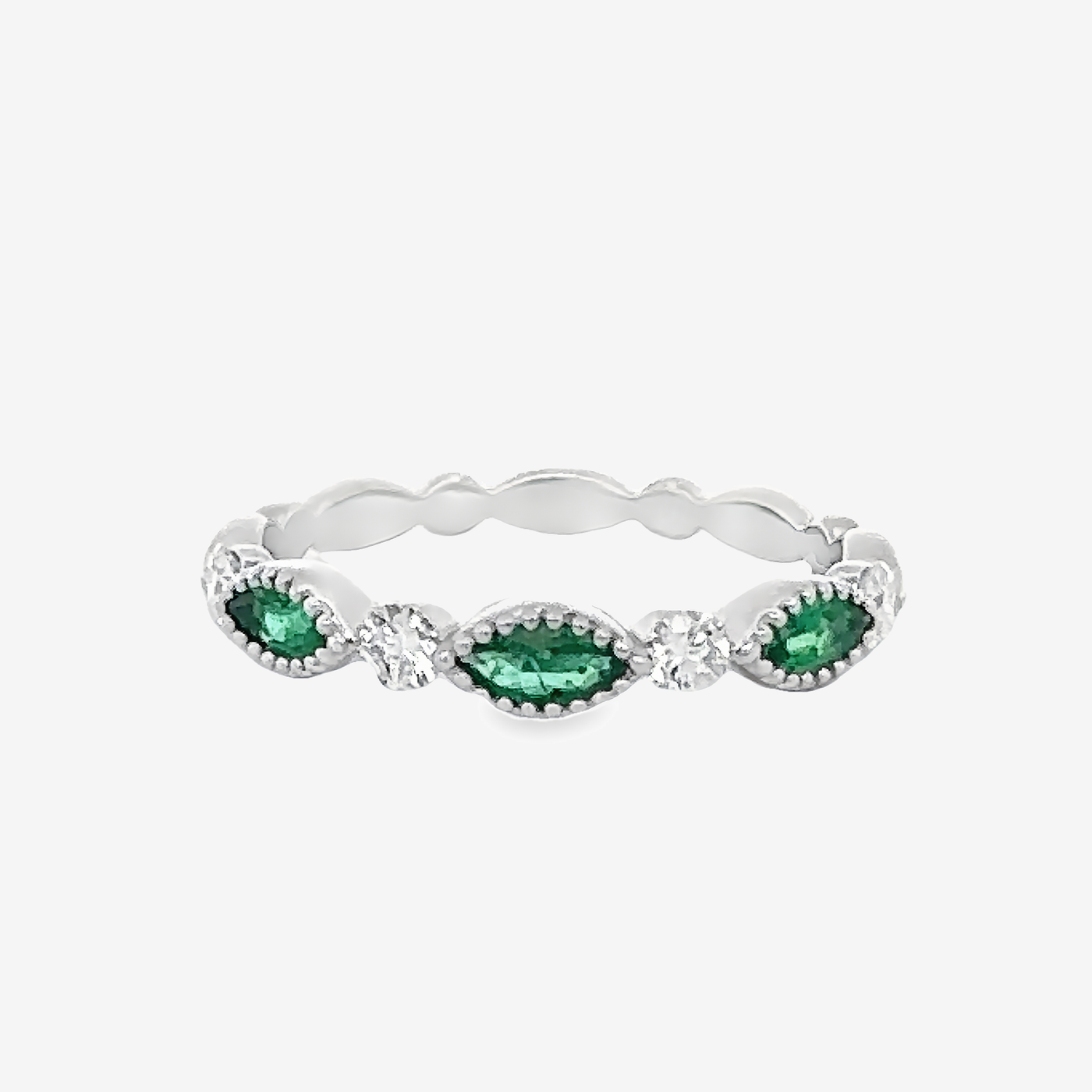 emerald and diamond ring with milgrain details