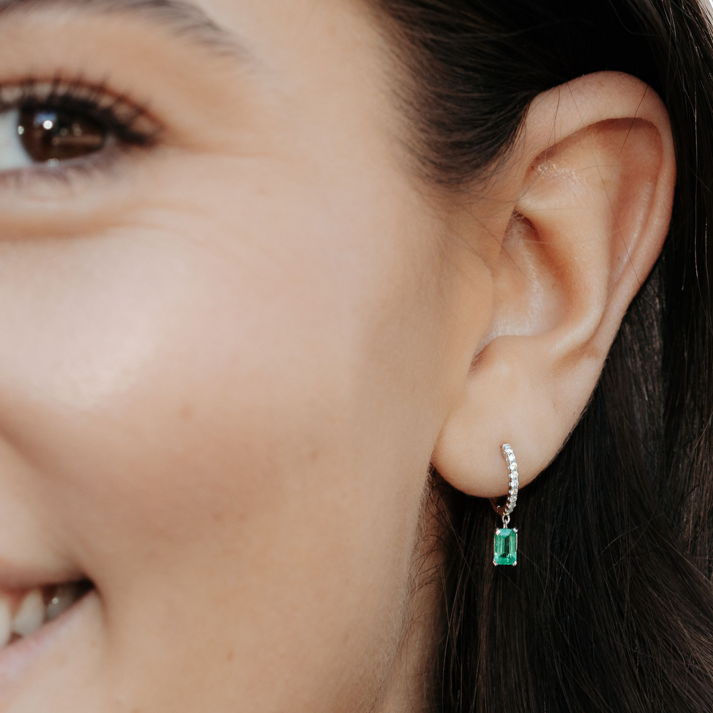 emerald and diamond huggie dangle earrings