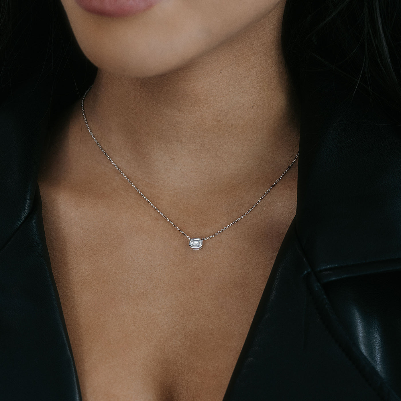petite emerald cut diamond solitaire necklace