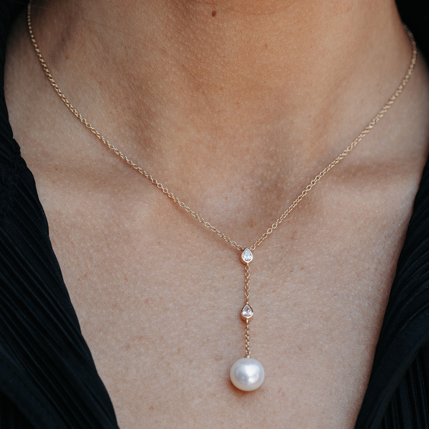 pearl and diamond lariat style necklace