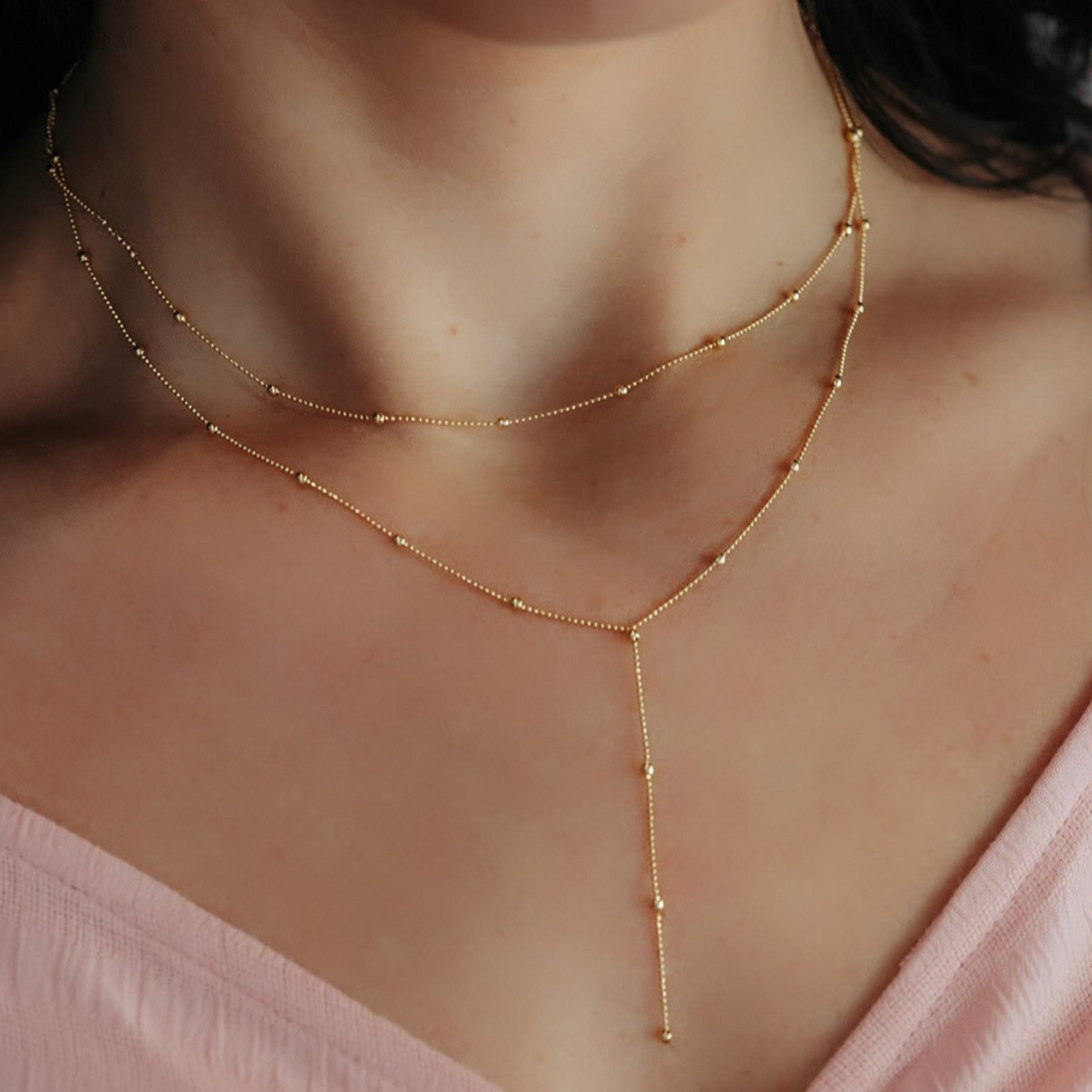 gold bead lasso style necklace