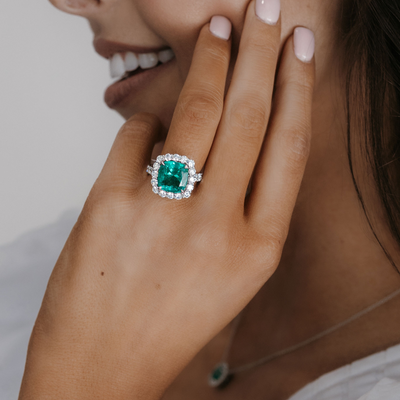 emerald and diamond halo cocktail ring