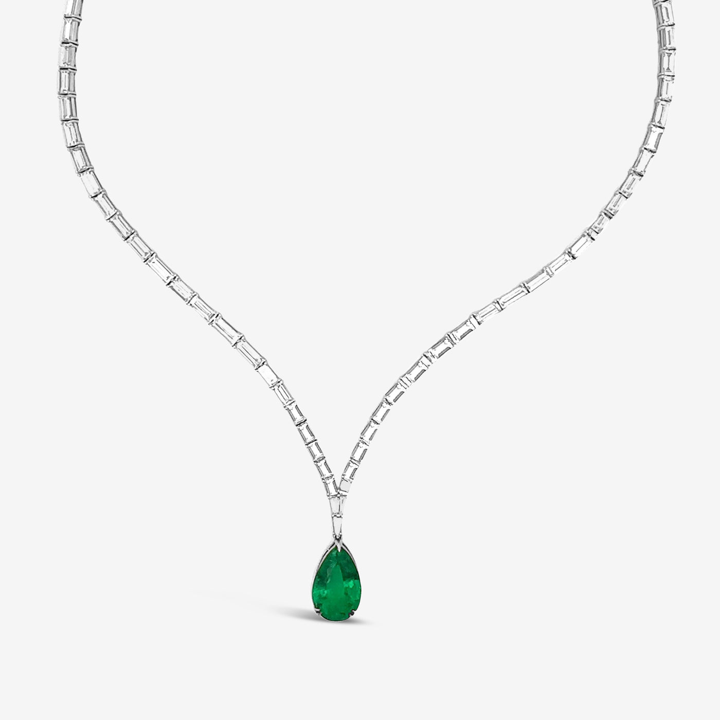 unique emerald and baguette diamond necklace