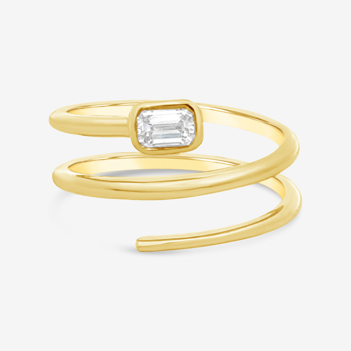 emerald cut diamond and gold spiral ring
