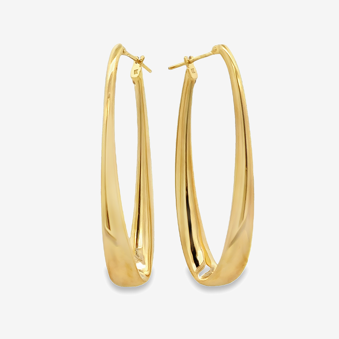 graduated gold oval earrings