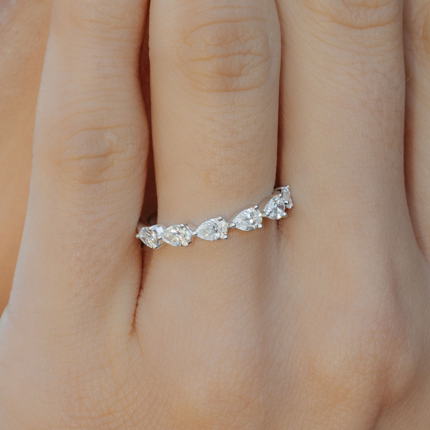 east west pear shaped diamond band