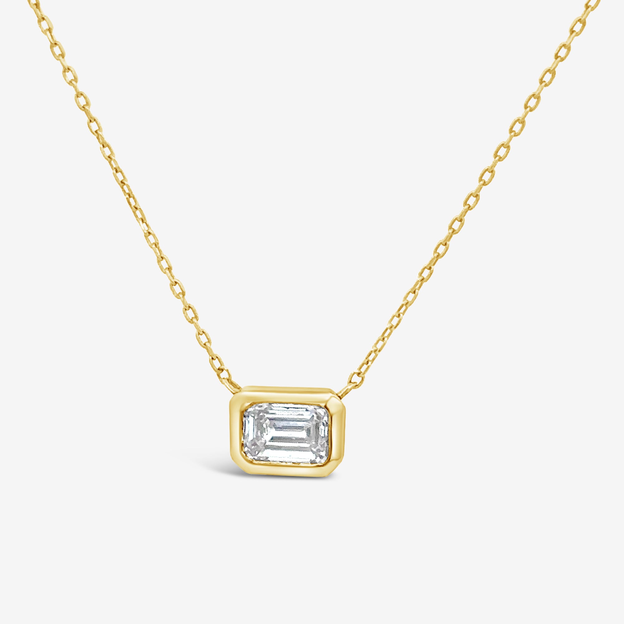 bezel set emerald cut diamond solitaire necklace