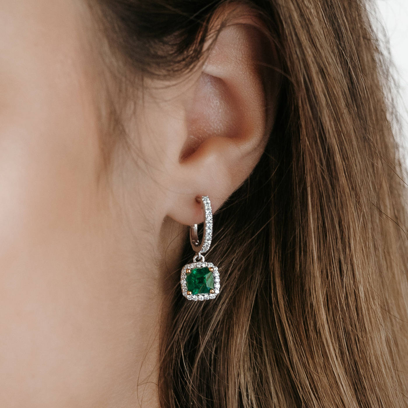 emerald and diamond halo dangle earrings