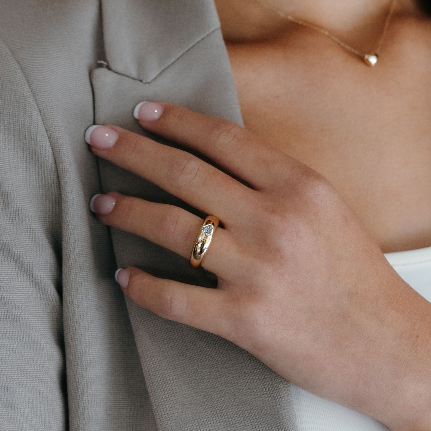 burnished heart shaped diamond and gold dome ring