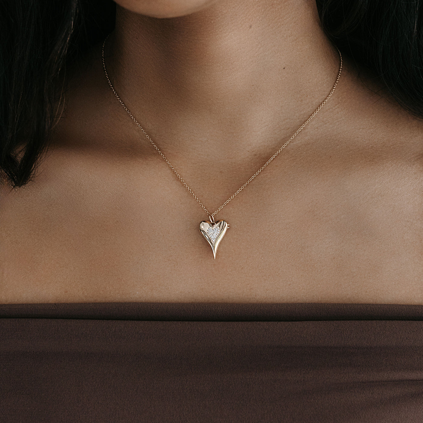 puffed gold and diamond heart shaped locket