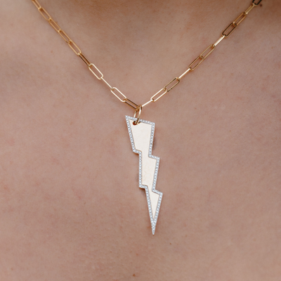diamond and gold lightning bolt pendant