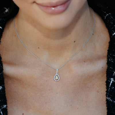yellow and white diamond halo pendant