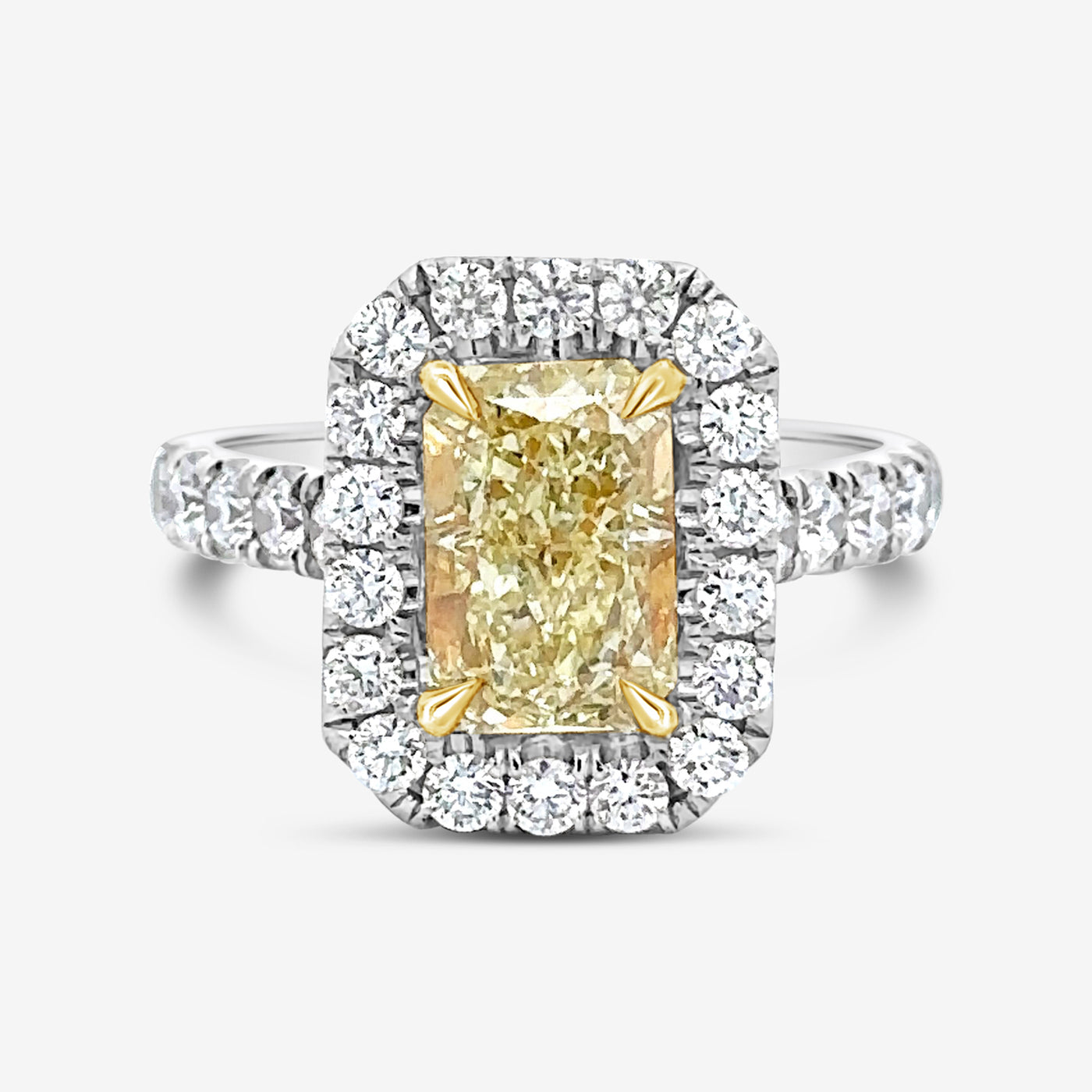 radiant cut yellow diamond and white diamond halo engagement ring