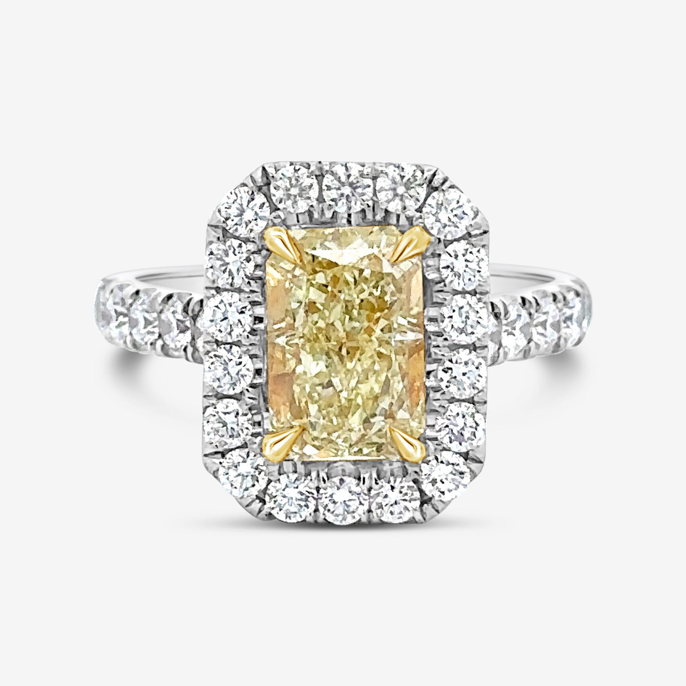 radiant cut yellow diamond and white diamond halo engagement ring