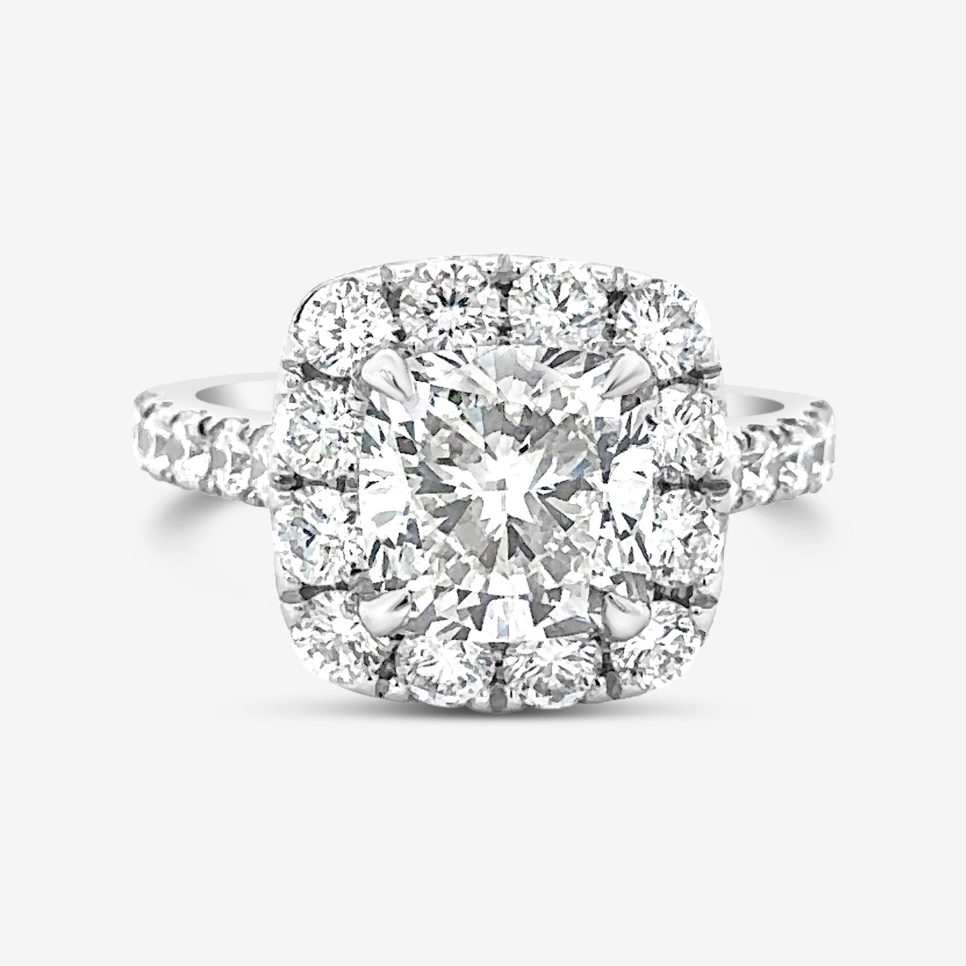 cushion cut diamond halo engagement ring in white gold