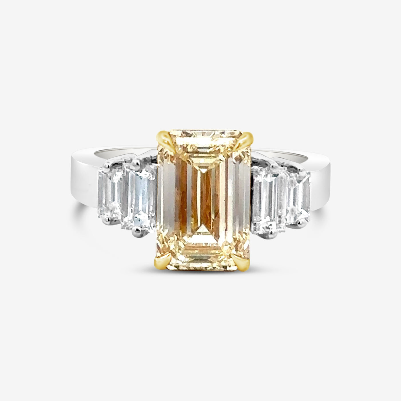 emerald cut yellow and white diamond three stone engagement ring