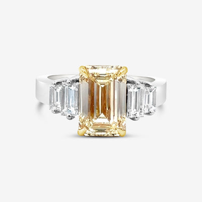 emerald cut yellow and white diamond three stone engagement ring