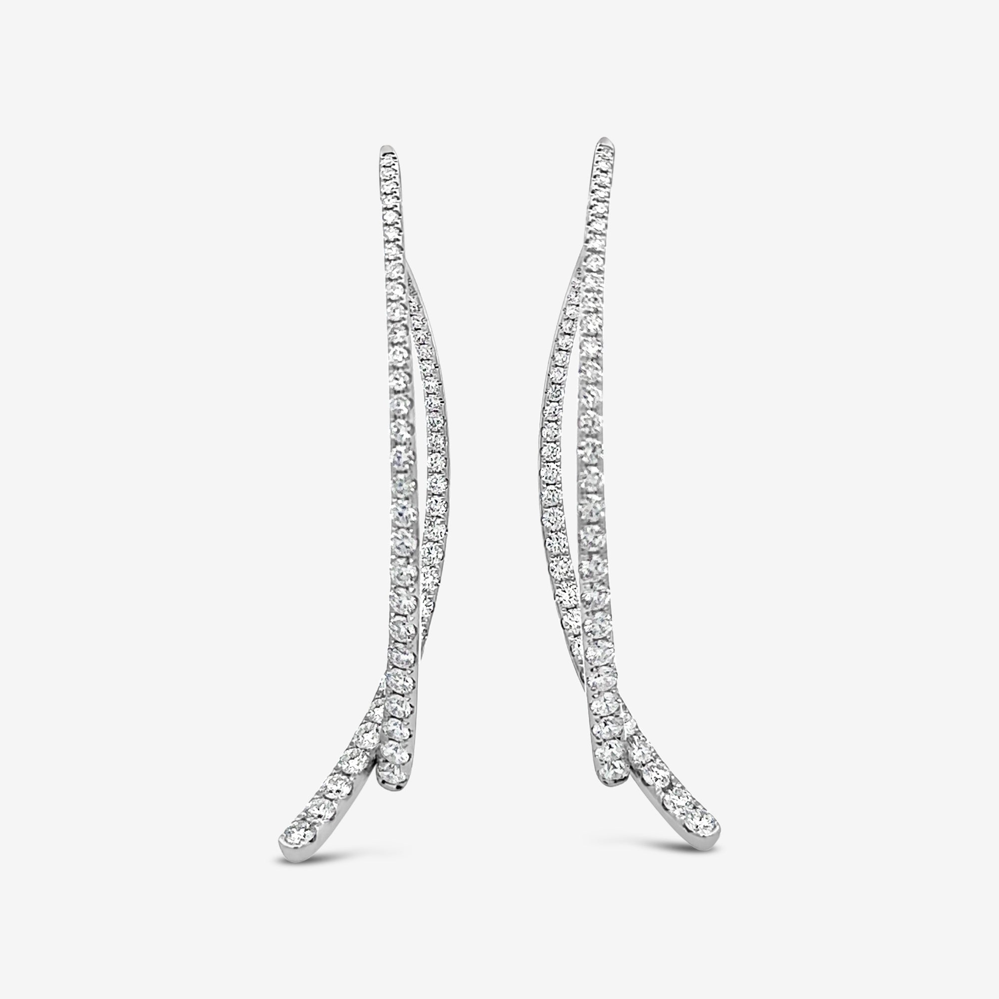 diamond covered white gold swing earrings