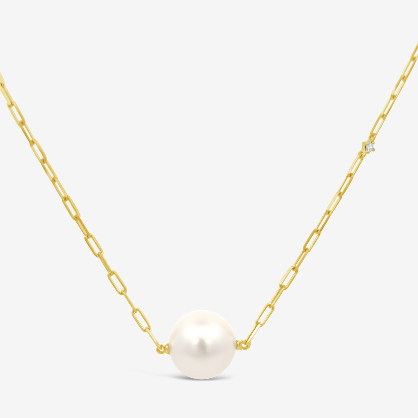 single pearl necklace on a gold paperclip chain