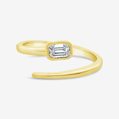 emerald cut diamond and gold wrap ring