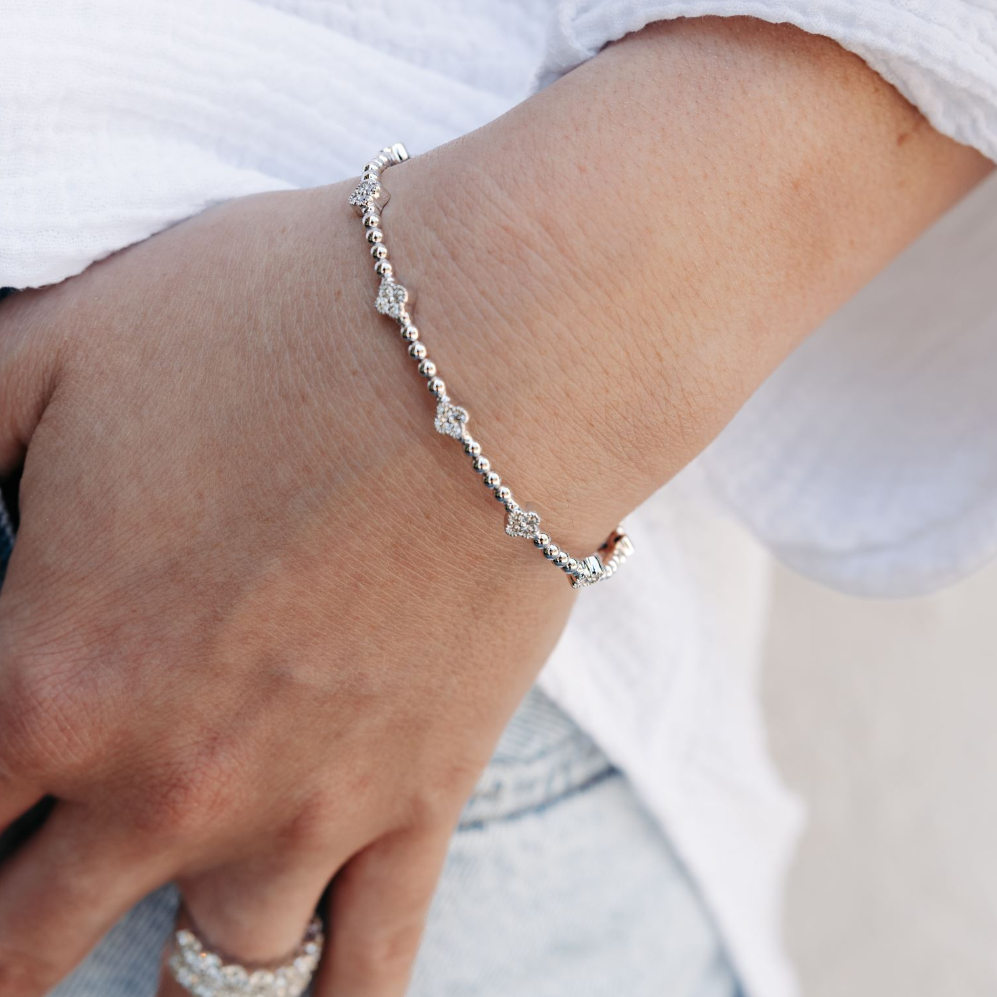 floral motif diamond and bead bracelet