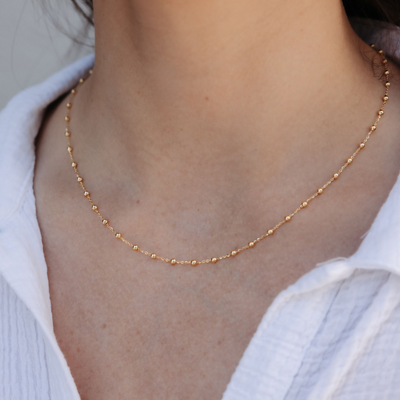 gold bead station necklace
