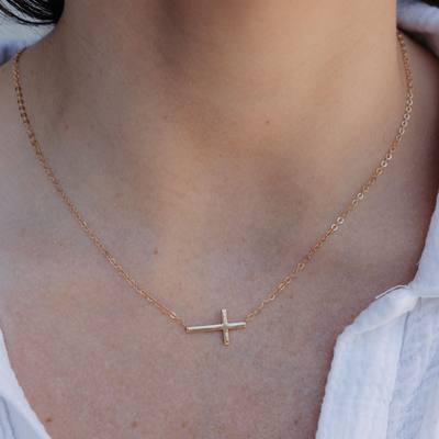 East/West gold cross necklace