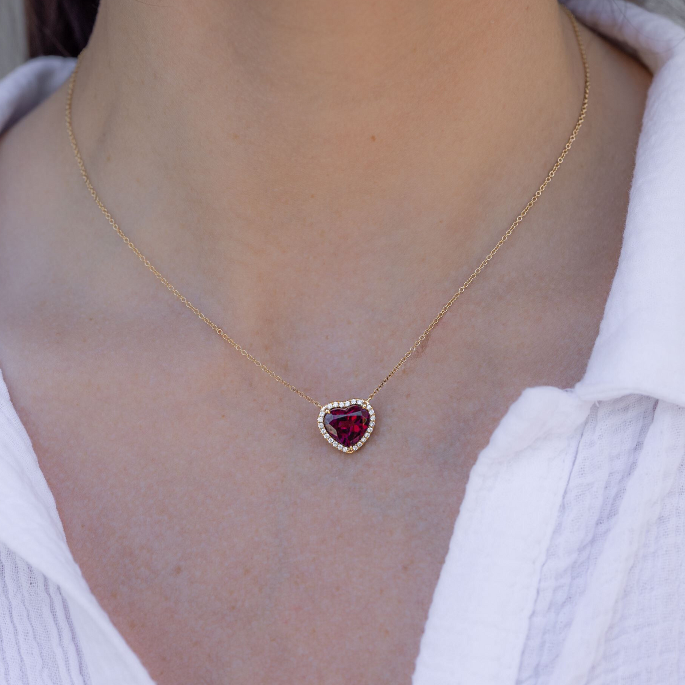 red heart shaped gemstone and diamond halo necklace