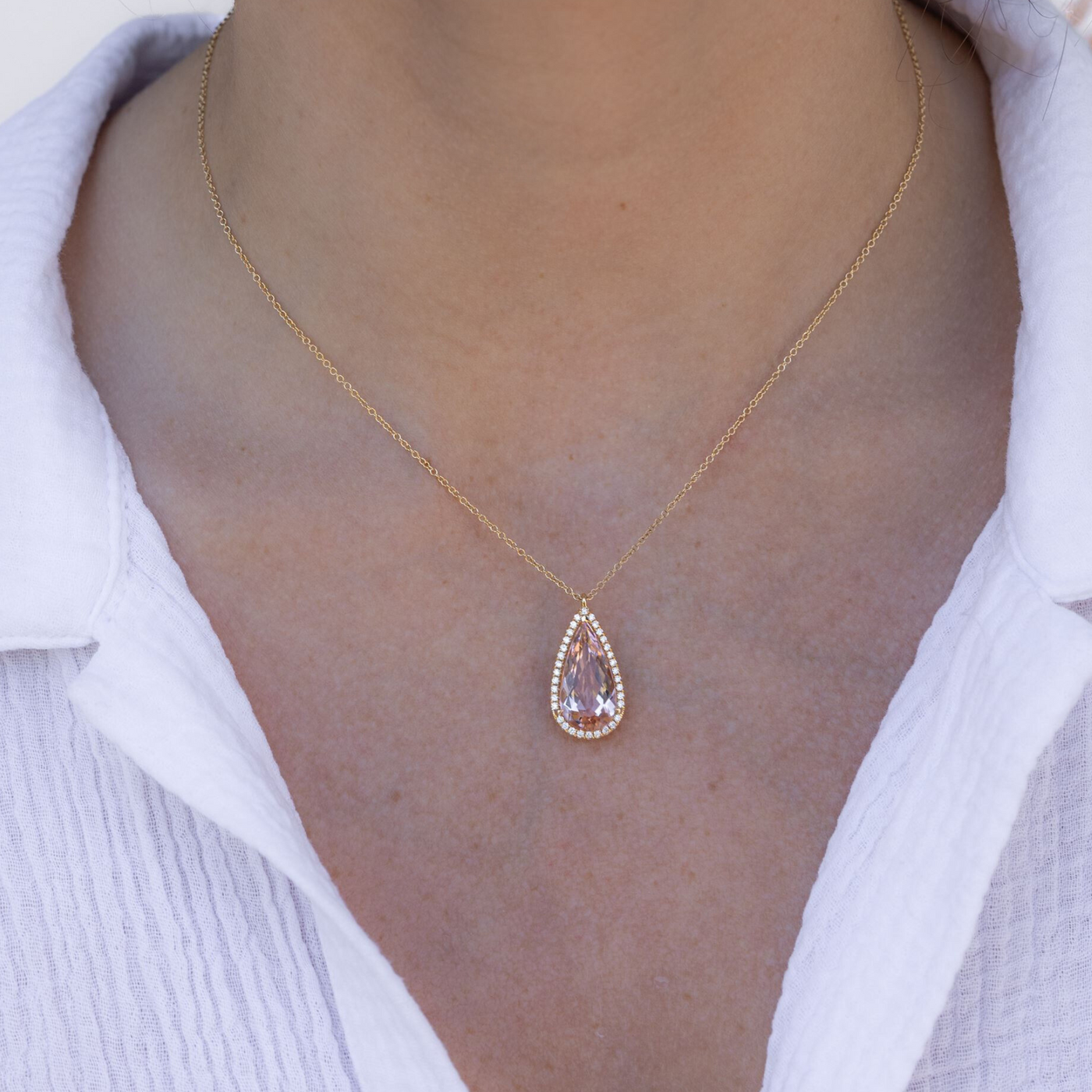 pink gemstone and diamond halo necklace