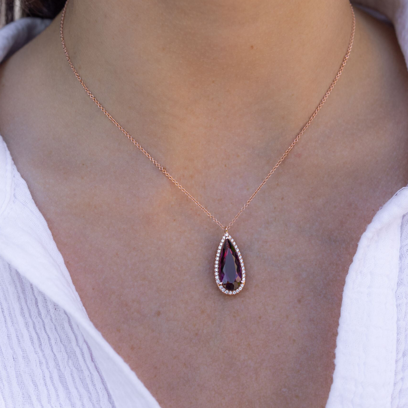 red gemstone and diamond halo necklace