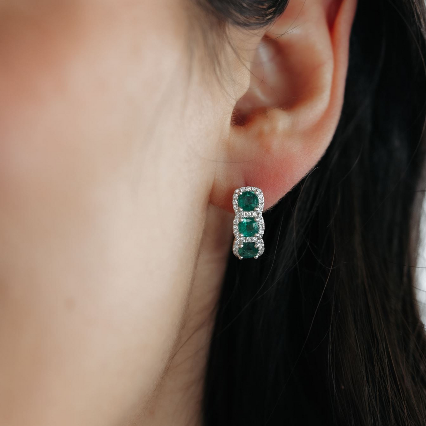 emerald and diamond halo huggie earrings