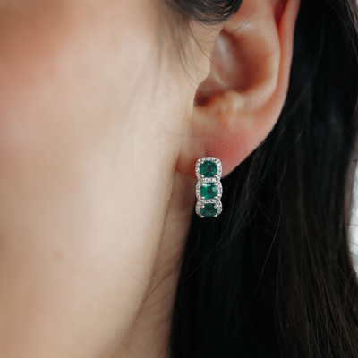 emerald and diamond halo huggie earrings