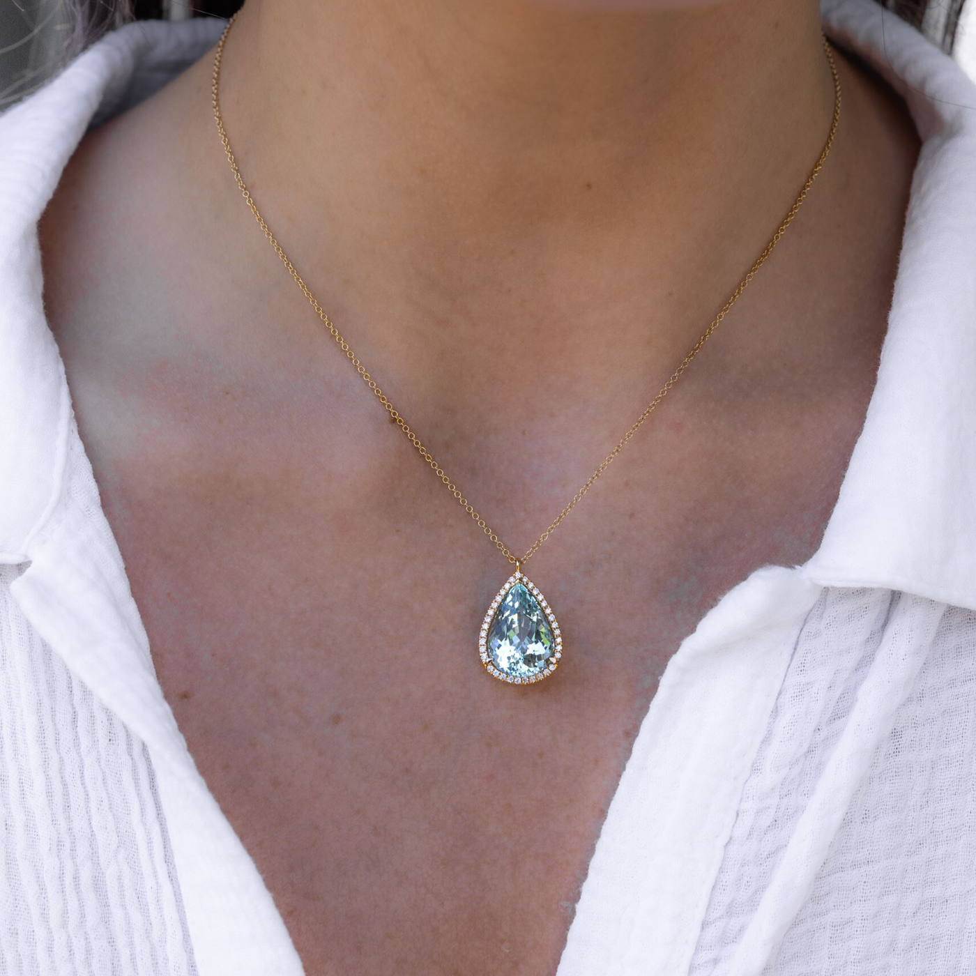 Aquamarine and diamond halo necklace