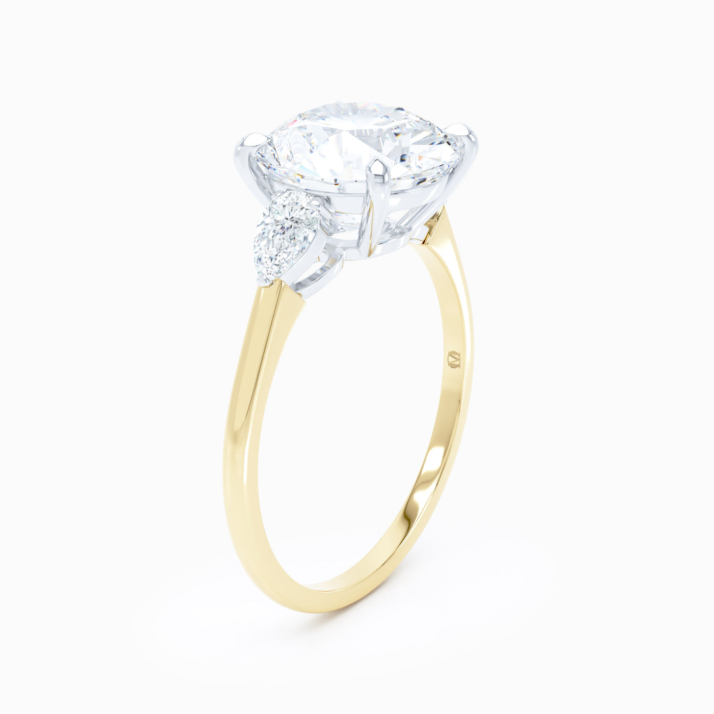 3 Stone Pear Shape Sides Round Engagement Ring