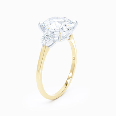 3 Stone Pear Shape Sides Round Engagement Ring