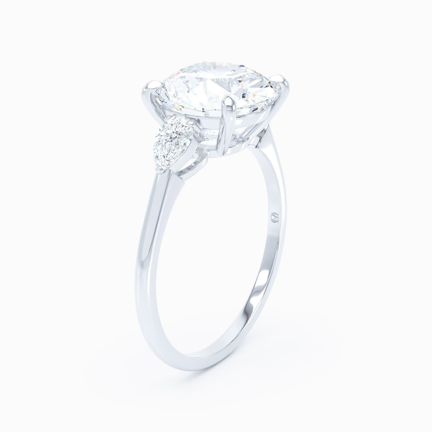 3 Stone Pear Shape Sides Round Engagement Ring