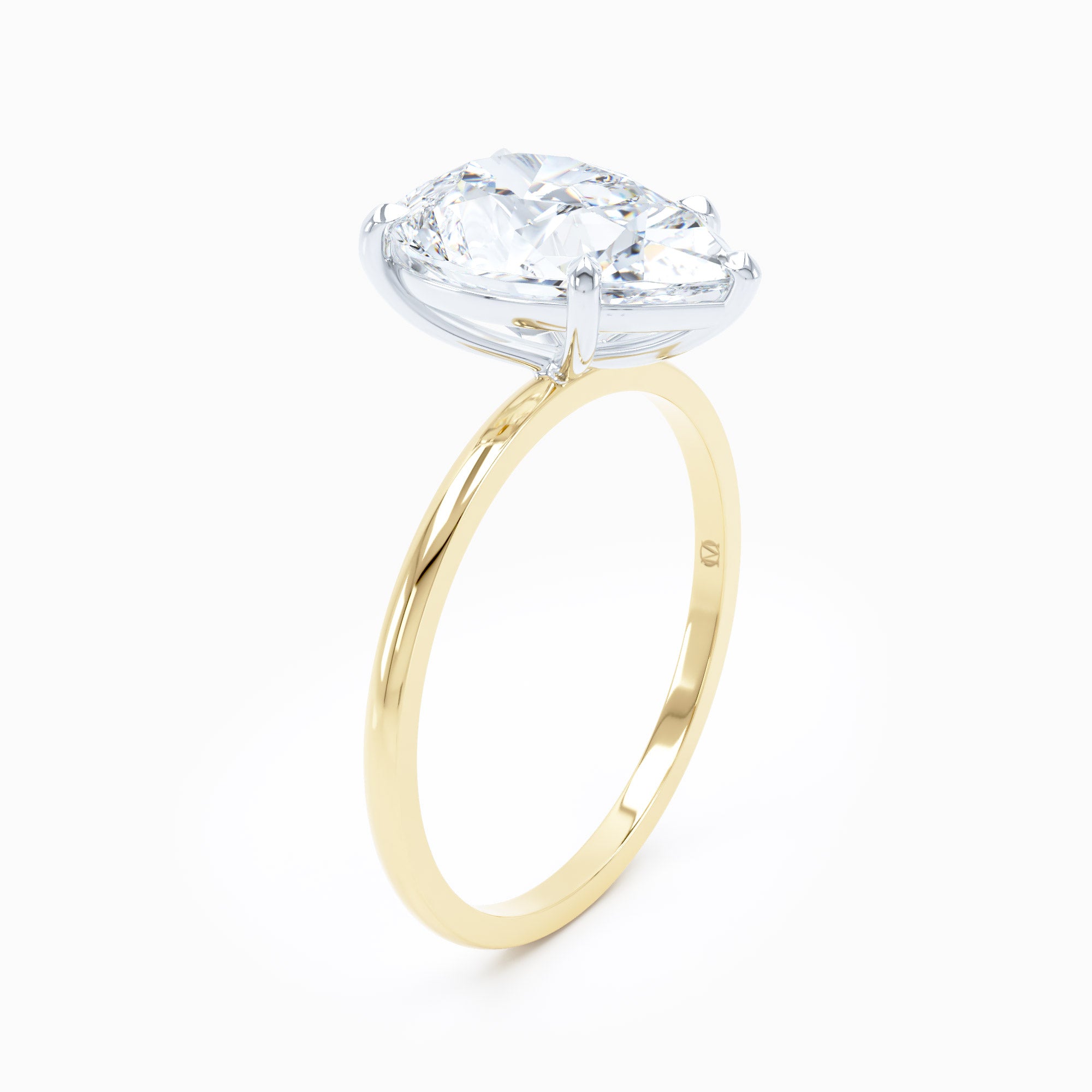 Petite Solitaire Pear Engagement Ring